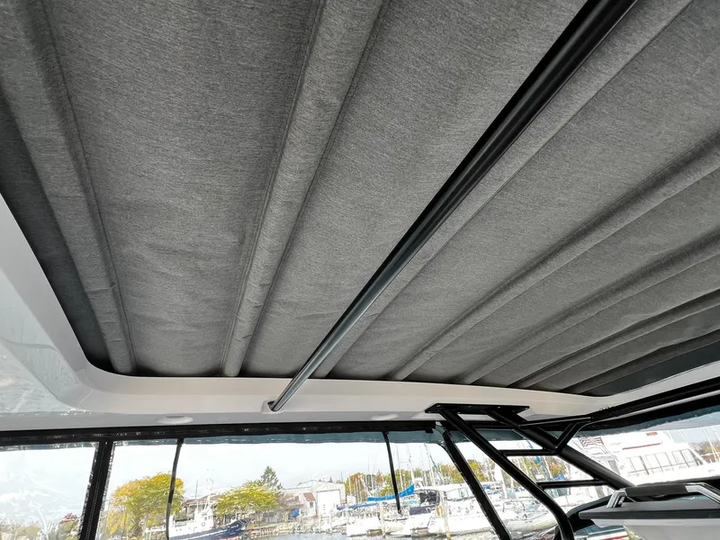 Slide: The Image of 2024 Axopar 37 Sun Top Mediterrana Edition with retractable sunroof detail. - 23