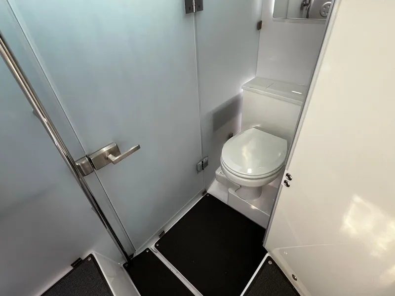 Slide: The Image of 2024 Axopar 37 Sun Top Mediterrana Edition bathroom interior with modern design and fixtures. - 30
