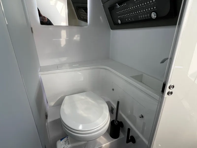 Slide: The Image of 2024 Axopar 37 Sun Top Mediterrana Edition bathroom interior with modern fixtures. - 31