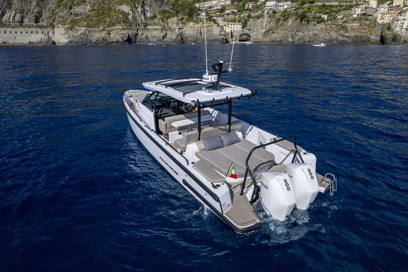 Slide: The Image of 2024 Axopar 37 Sun Top Mediterrana Edition cruising on blue waters. - 35