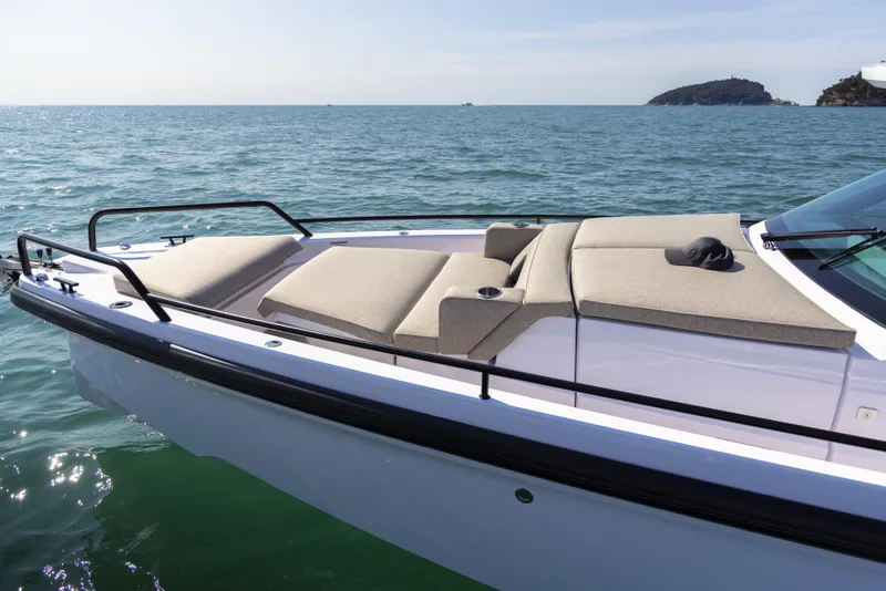 Slide: The Image of 2024 Axopar 37 Sun Top Mediterrana Edition boat with sun loungers on the deck. - 37