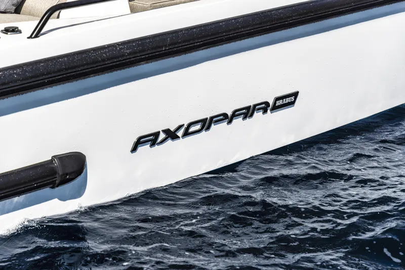 Slide: The Image of 2024 Axopar 37 Sun Top Mediterrana Edition boat on water. - 40