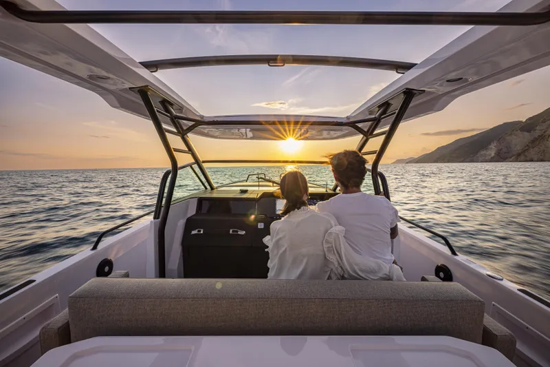 Slide: The Image of Couple enjoying sunset on 2024 Axopar 37 Sun Top Mediterrana Edition boat. - 43