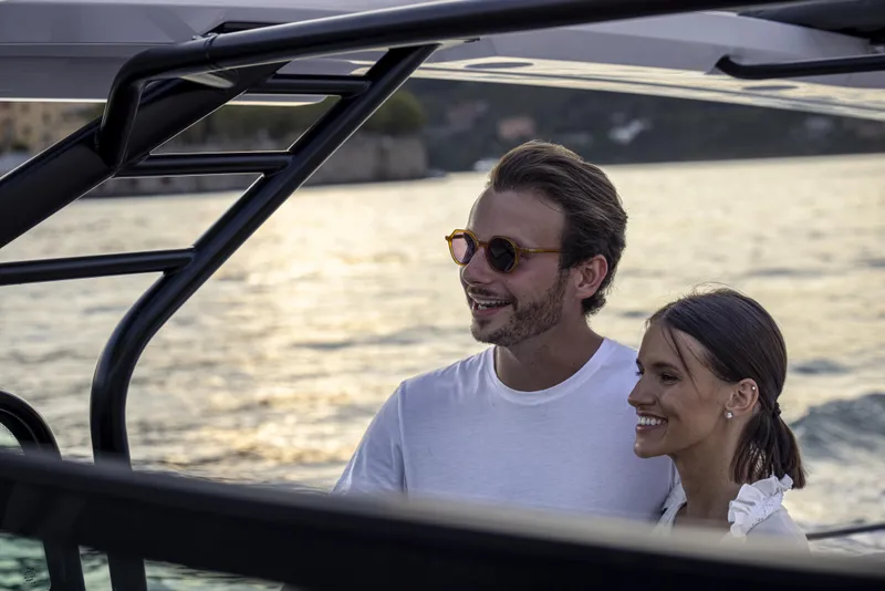 Slide: The Image of Couple enjoying sunset on 2024 Axopar 37 Sun Top Mediterrana Edition boat. - 45