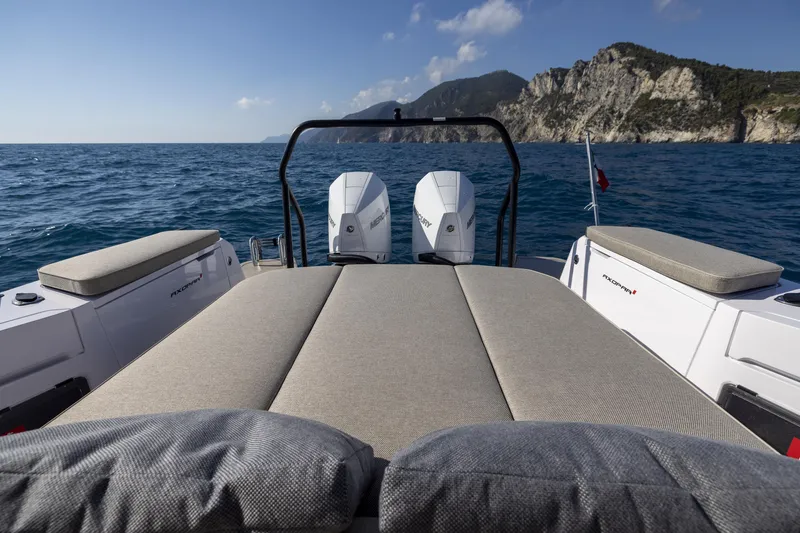 Slide: The Image of 2024 Axopar 37 Sun Top Mediterrana Edition boat with twin engines on open water. - 47