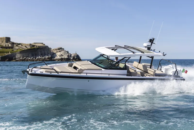 Slide: The Image of 2024 Axopar 37 Sun Top Mediterrana Edition cruising on the ocean. - 51