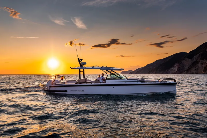 Slide: The Image of 2024 Axopar 37 Sun Top Mediterrana Edition cruising at sunset. - 53