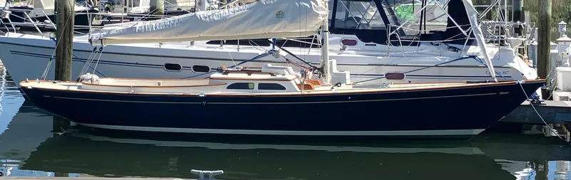 Slide: The Image of 2012 Morris M29 sailboat docked at a marina. - 13