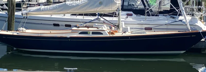 Slide: The Image of 2012 Morris M29 sailboat docked in a marina. - 14