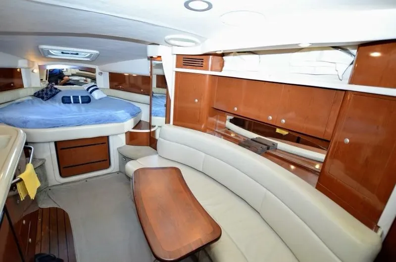 Slide: The Image of Interior of 2007 Sea Ray 340 Sundancer with cozy seating and sleeping area. - 3