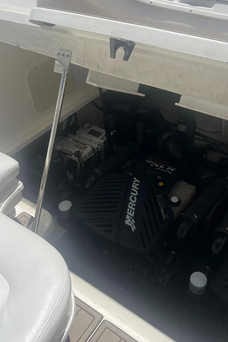 Slide: The Image of 2007 Sea Ray 340 Sundancer engine compartment with Mercury engine. - 5