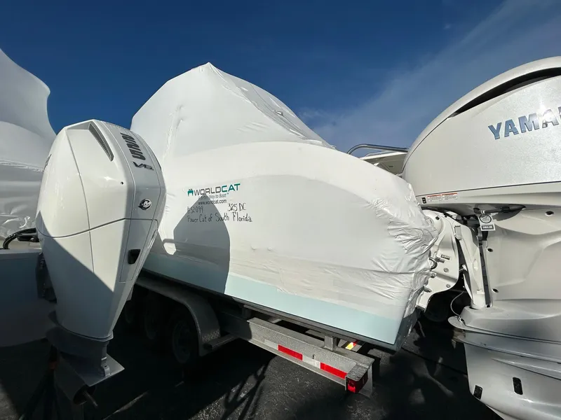 The Image of Wrapped World Cat 325 DC boat on trailer, 2026 model. - 0