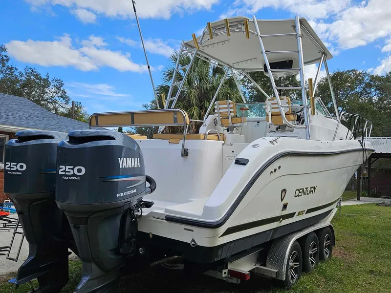 Slide: The Image of 2001 Century 3200 Walk-Around boat with twin Yamaha 250 engines. - 14