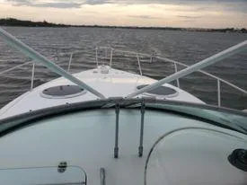 Slide: The Image of Century 3200 Walk-Around 2001 boat on water at sunset. - 21