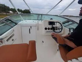 Slide: The Image of 2001 Century 3200 Walk-Around boat cockpit with steering wheel and controls. - 22