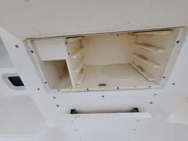 Slide: The Image of 2001 Century 3200 Walk-Around boat storage compartment. - 40