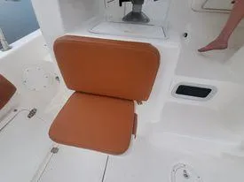 Slide: The Image of Century 3200 Walk-Around 2001 boat with brown cushioned seat and white deck. - 41