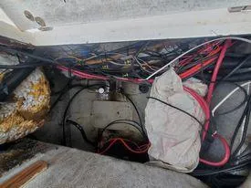 Slide: The Image of 2001 Century 3200 Walk-Around boat wiring and storage compartment. - 47