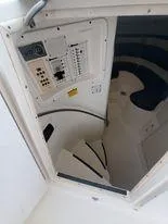 Slide: The Image of 2001 Century 3200 Walk-Around cabin interior with control panel and seating. - 48