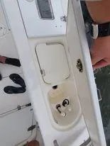 Slide: The Image of 2001 Century 3200 Walk-Around boat sink and storage compartment. - 49