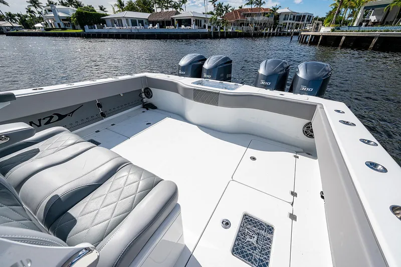 Slide: The Image of 2019 Freeman 37 boat with quad engines, spacious deck, and luxurious seating. - 10