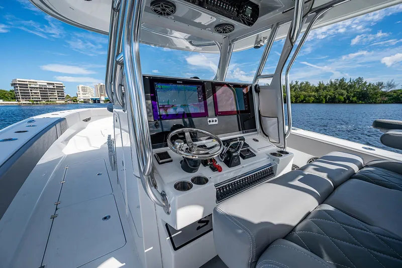 Slide: The Image of 2019 Freeman 37 boat cockpit with modern navigation system and luxurious seating. - 12