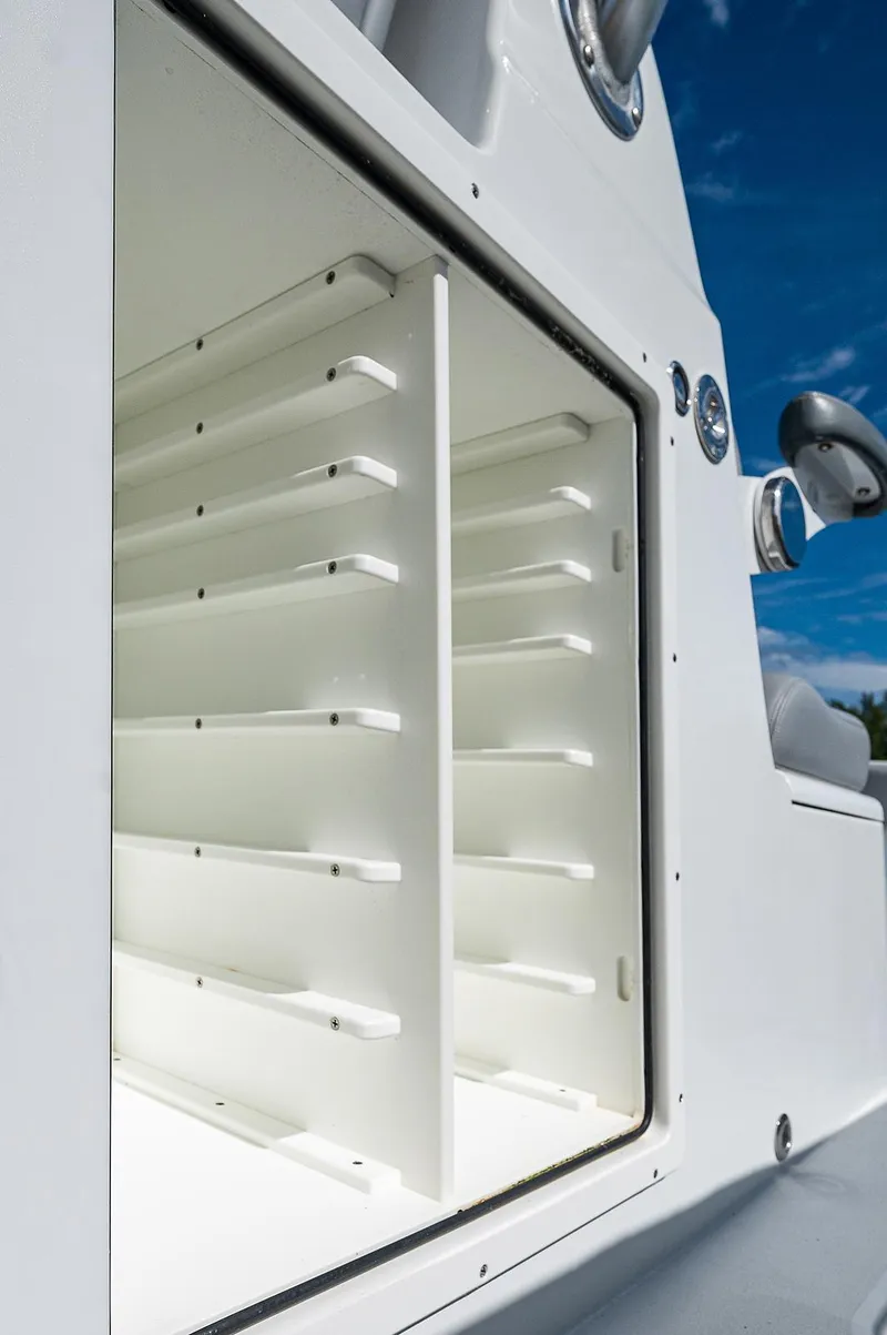 Slide: The Image of Freeman 37 boat storage compartment, 2019 model, open with multiple shelves. - 15