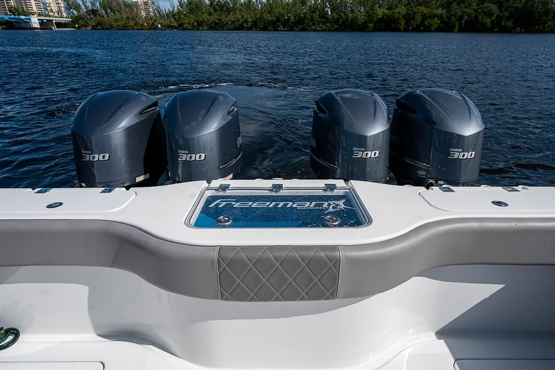 Slide: The Image of 2019 Freeman 37 boat with four 300 horsepower engines on water. - 20