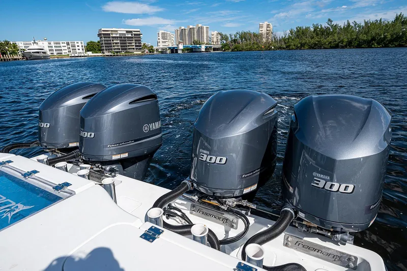 Slide: The Image of Freeman 37 boat with four Yamaha 300 outboard engines, 2019 model, on a scenic waterway. - 21