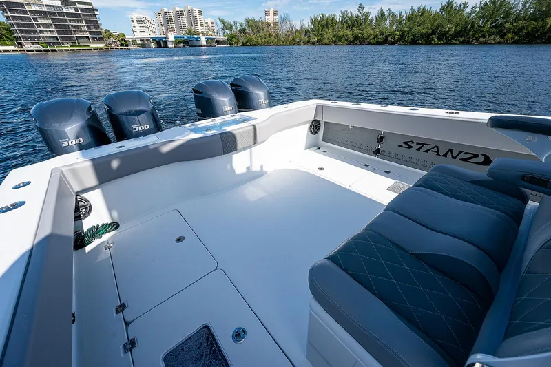 Slide: The Image of 2019 Freeman 37 boat with triple 300 engines on a scenic waterway. - 26