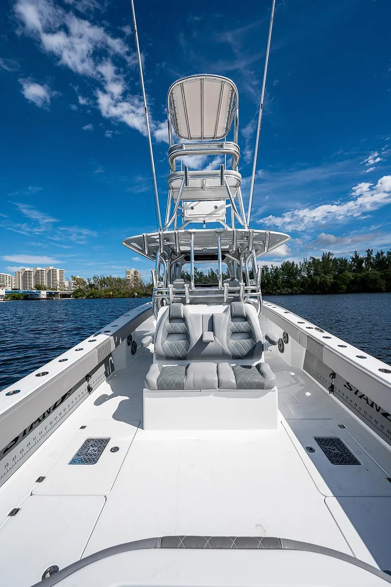 Slide: The Image of 2019 Freeman 37 boat with dual seating and tower on a sunny day. - 4