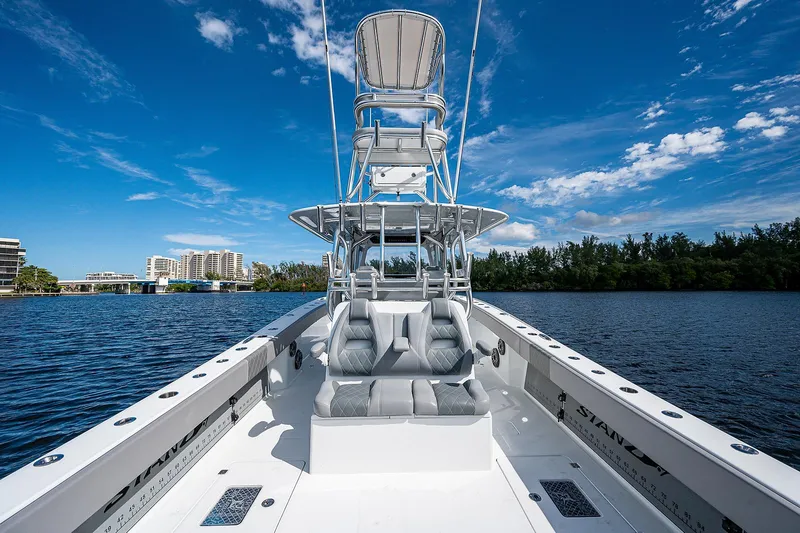 Slide: The Image of 2019 Freeman 37 boat on calm water with clear blue sky. - 5