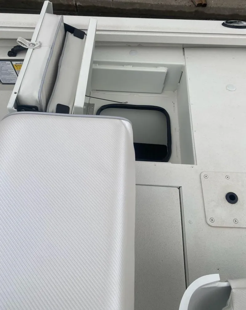 Slide: The Image of 2024 Ranger RB190 boat interior with storage compartments and seating. - 10