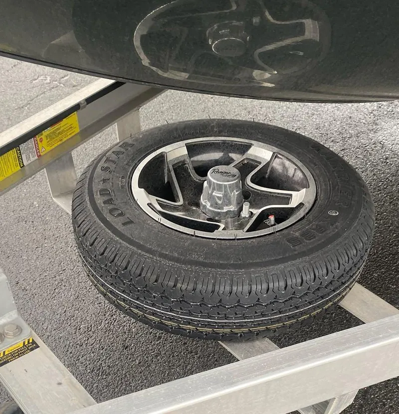 Slide: The Image of 2024 Ranger RB190 trailer tire on metal frame, close-up view. - 18