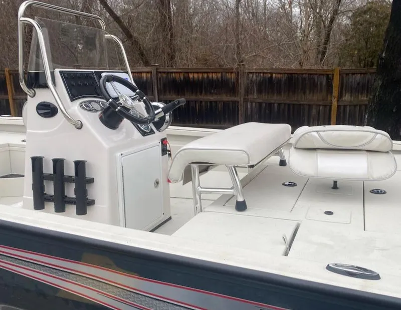 Slide: The Image of 2024 Ranger RB190 boat interior with steering console and seating. - 3