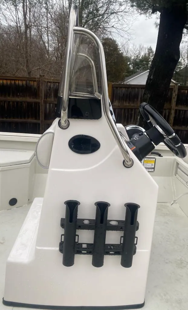 Slide: The Image of 2024 Ranger RB190 boat console with rod holders and steering wheel. - 5