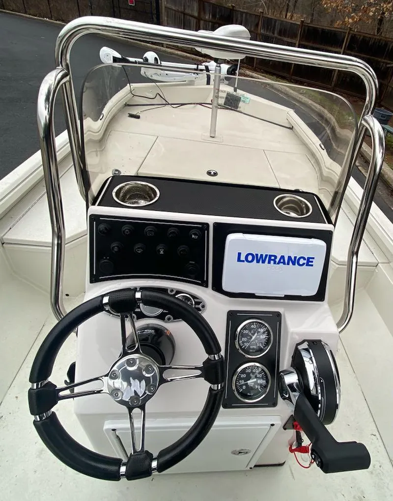 Slide: The Image of 2024 Ranger RB190 boat console with Lowrance electronics and steering wheel. - 6