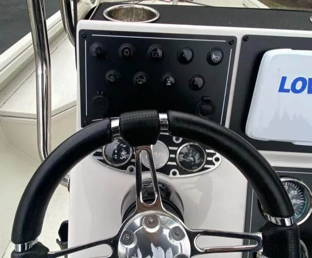Slide: The Image of 2024 Ranger RB190 boat dashboard with steering wheel and control panel. - 7