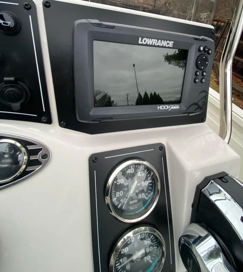 Slide: The Image of 2024 Ranger RB190 boat dashboard with Lowrance Hook display and speed gauges. - 8