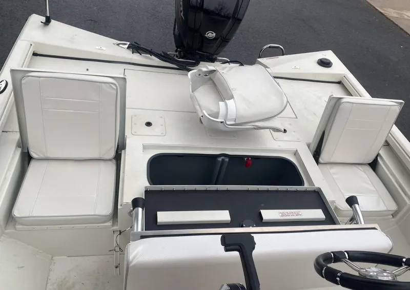 Slide: The Image of 2024 Ranger RB190 boat interior with seating and steering wheel. - 9