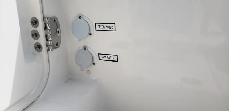 Slide: The Image of 2024 Pursuit S 358 Sport boat fresh and raw water outlets. - 16