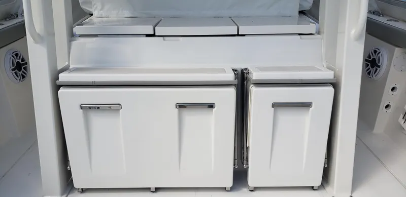 Slide: The Image of 2024 Pursuit S 358 Sport boat storage compartments and seating area. - 19