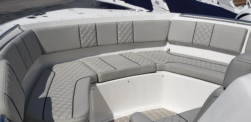 Slide: The Image of 2024 Pursuit S 358 Sport boat with luxurious gray seating. - 22