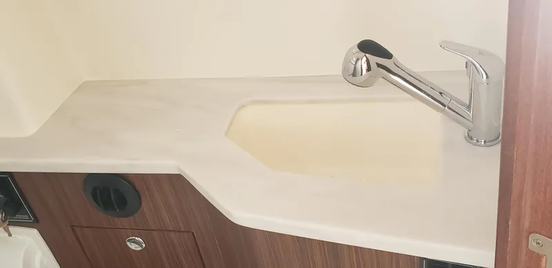 Slide: The Image of 2024 Pursuit S 358 Sport boat interior sink and faucet. - 31