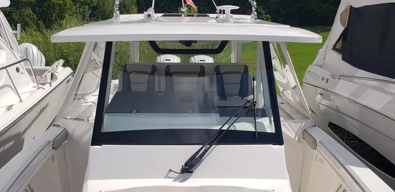 Slide: The Image of 2024 Pursuit S 358 Sport boat with sleek design and spacious seating. - 6