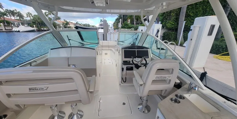 Slide: The Image of Interior view of a 2021 Boston Whaler 320 Vantage boat at dock. - 11