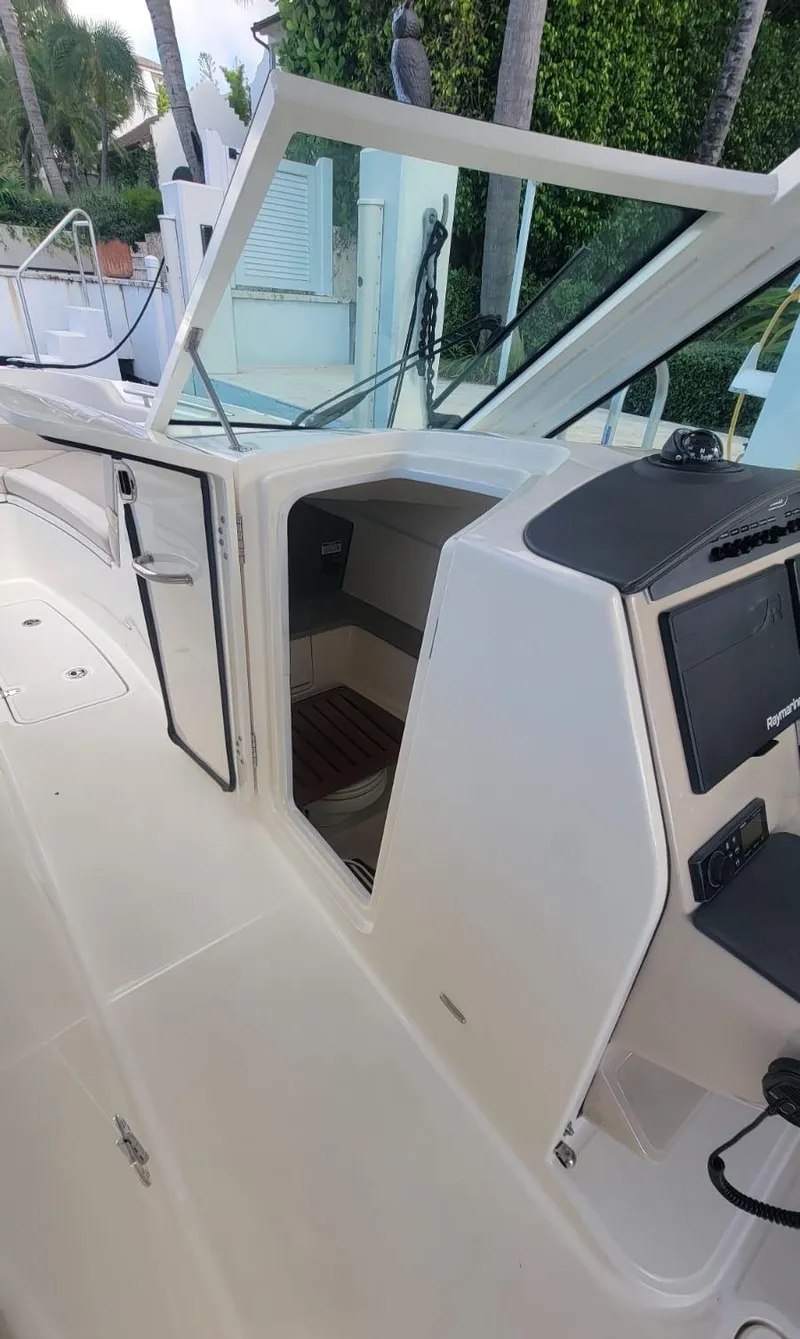 Slide: The Image of Boston Whaler 320 Vantage 2021 with open cockpit and helm area. - 18