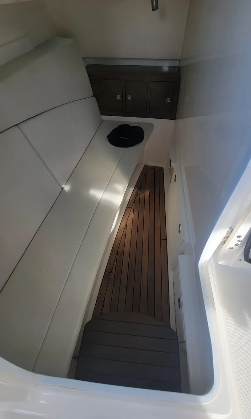 Slide: The Image of Interior of 2021 Boston Whaler 320 Vantage with wooden flooring. - 19