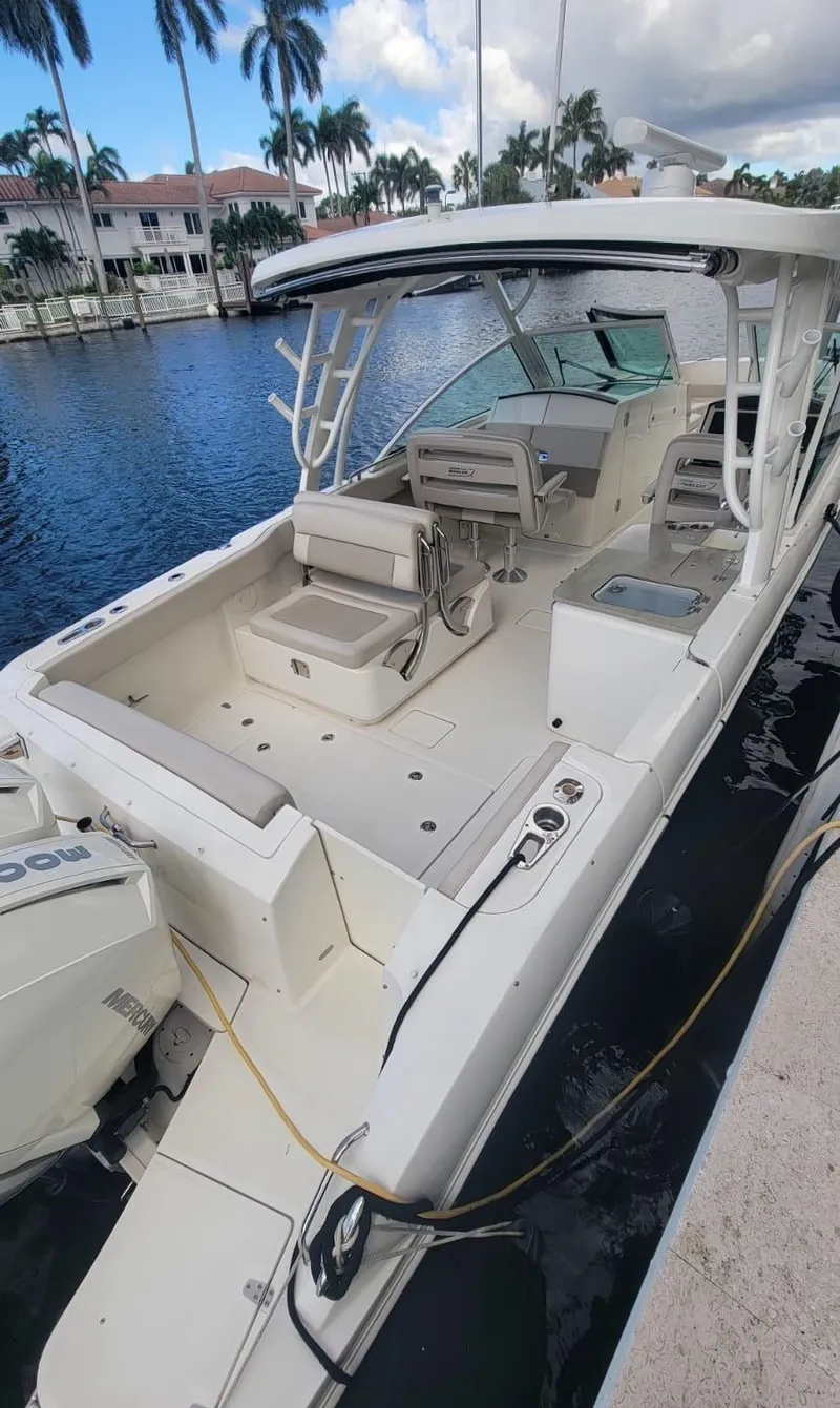 Slide: The Image of 2021 Boston Whaler 320 Vantage docked, luxury boat. - 7