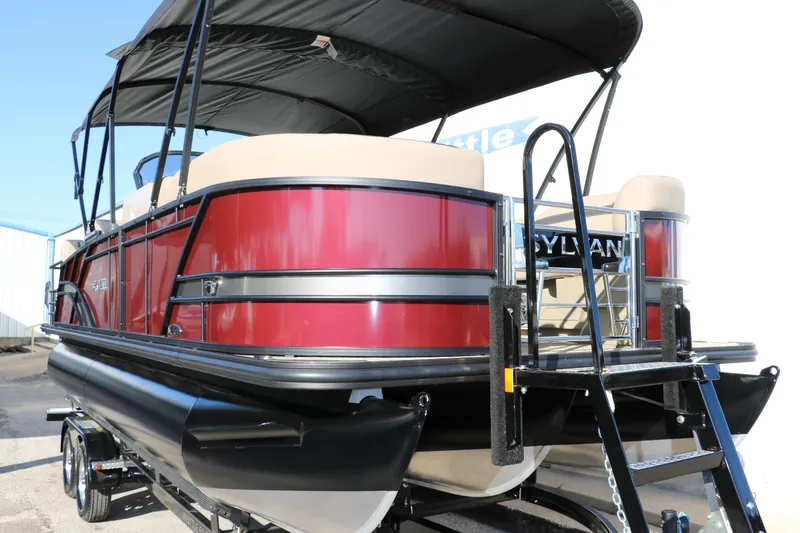 Slide: The Image of 2024 Sylvan L3 RLZ pontoon boat with red exterior and black canopy. - 10